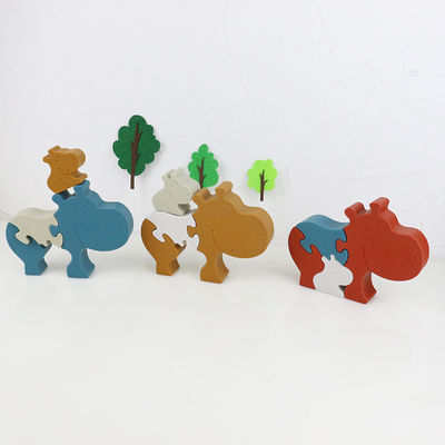 Silicone en de houten puzzel die dierlijke hippo het bevinden zich brengen jong geitjespeelgoed voor kind het spelen in verwarring