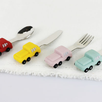 De Babylepel van het peuterroestvrije staal met het Siliconehandvat van de Autovorm