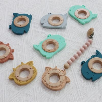 Multifunktioneel siliconen baby-tandappel met aansluitbaar tandvlees houten ring dierpatroon