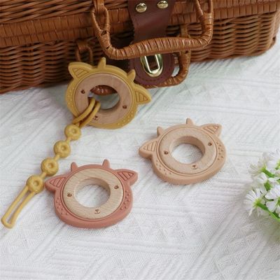 Multifunktioneel siliconen baby-tandappel met aansluitbaar tandvlees houten ring dierpatroon