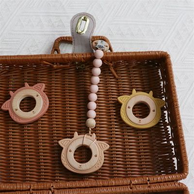Multifunktioneel siliconen baby-tandappel met aansluitbaar tandvlees houten ring dierpatroon